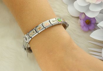 Złota zawieszka Nomination z sercem i napisem Mom. Wykonana z 18K złota i stali szlachetnej. Idealny prezent dla mamy – na każdą okazję (1).jpg